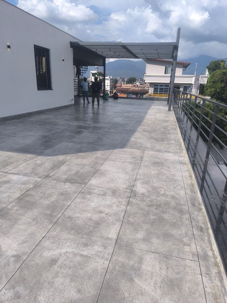 Grey concrete rooftop flooring